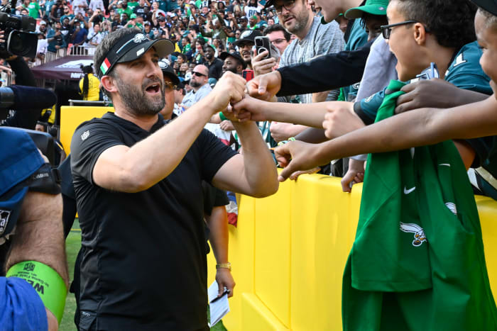 Philadelphia Eagles head coach Nick Sirianni celebrates with fans after the game against the Washington Commanders at FedExField.